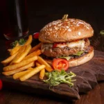 A mug of rich hot chocolate topped with whipped cream, chocolate drizzle and marshmallows at the best bakery in Wayanad